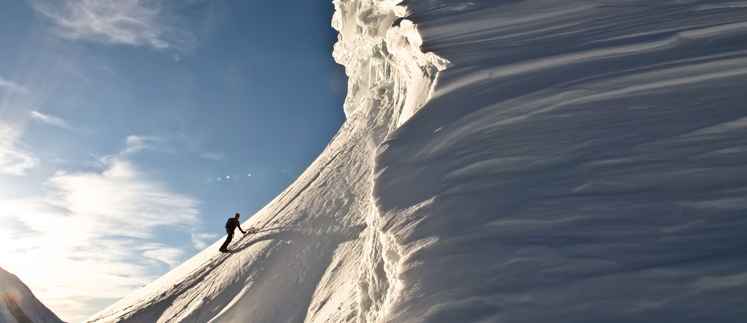 Jesse Mattner following the cornice pitch on the Southwest Ridge of Mt Frances in the Alaska Range, where the hateful knee-deep snow finally gave way to firm neve.